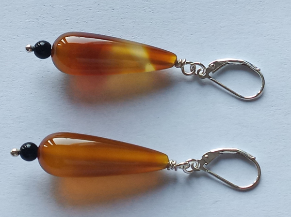 silver earrings-leverbacks with agate drops and onyx beads-the colours are amber and black-